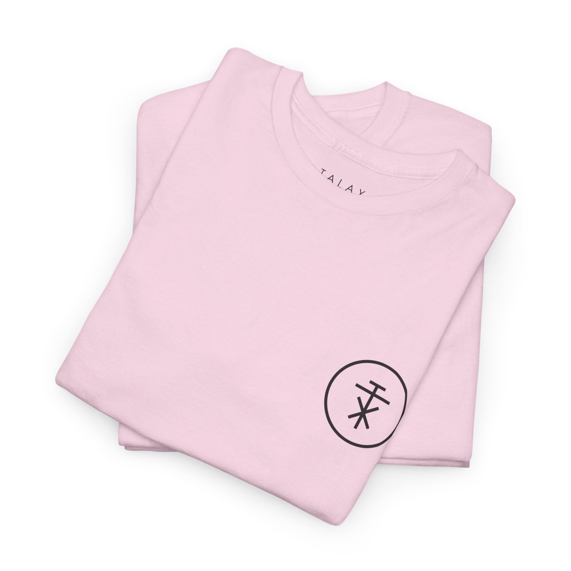 Folded TALAX pink tees with front insignia visible